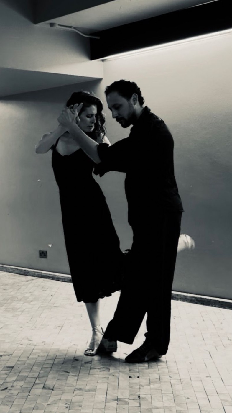Dana and Daniel dancing in close embrace