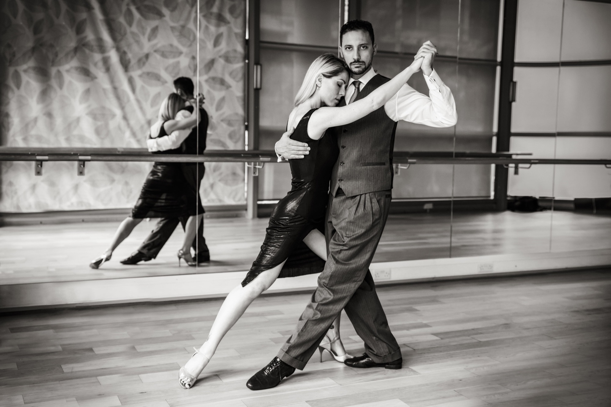 A couple dancing Argentine tango in a close embrace