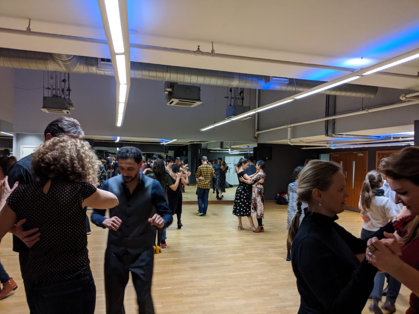 Couples practising in a Tango Integral class in London